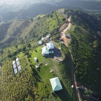 Aerial view of Montaña Redonda hilltop with swings and surrounding forest