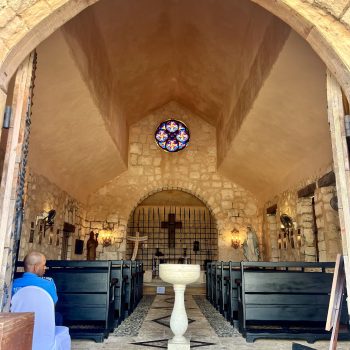 Dome and altar inside the stone church of Altos de Chavón