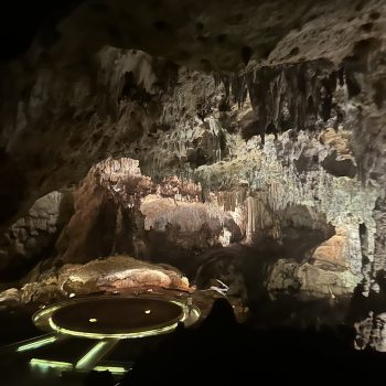 Stone platform and altar-style rock inside the dimly lit Cave of Wonders