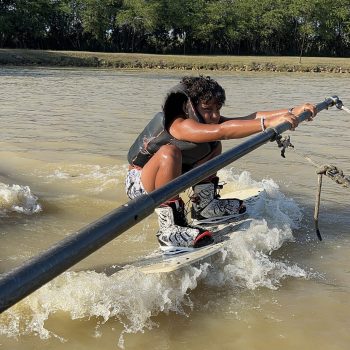 Long and narrow artificial lake for water sports surrounded by trees